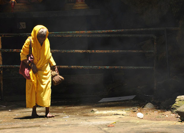 Hindu worshiper who never cut her hair. Batu Caves, Malaysia.