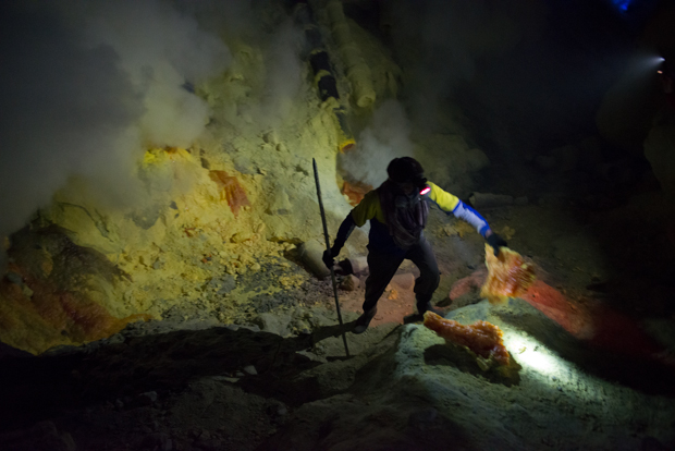 Miner carrying extracted sulfur