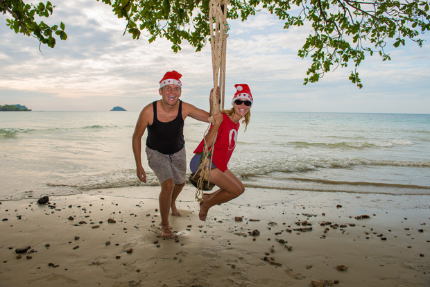 Us and a tree swing on a beach