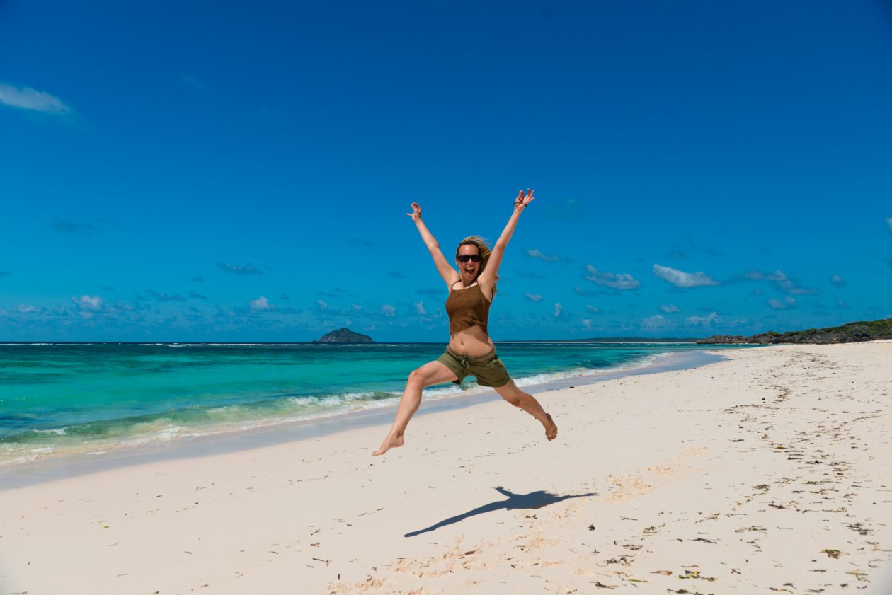 Jumping in extasy on Bua Beach, Rote Island, Indonesia